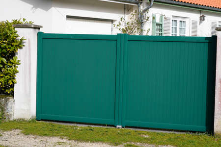 green closed house door metal home gate entrance