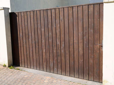 door wooden gate large design in street view outdoor home portal entranceの写真素材