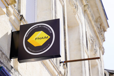 Bordeaux, Aquitaine France - 03 22 2021: fnaim yellow sign and brand text on building office of real estate store agencyのeditorial素材