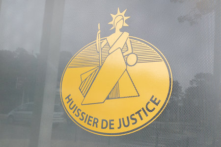 Bordeaux, Aquitaine France - 03 29 2021: huissier de justice logo and text sign in france means agency bailiff in French on office wallのeditorial素材