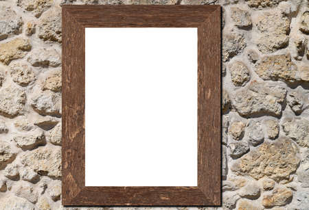 Wooden frame leaning on stone background in interior mockup template of white picture framed on a...