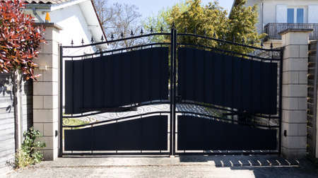 black classical gate of classic detached house in suburb street