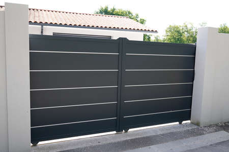 modern gray high design gate aluminum portal outdoor door front of suburb houseの写真素材
