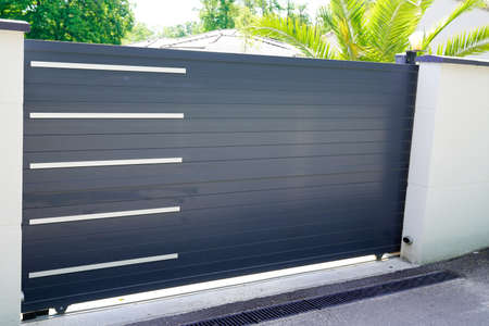 Aluminum slide door gray sliding metal gate house portal of suburb home
