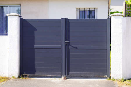 portal steel high gray metal gate fence on modern house door