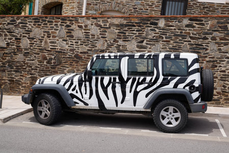 Bordeaux, Aquitaine France - 05 27 2021: Jeep Wrangler zebra car paint 4x4 model all road custom...