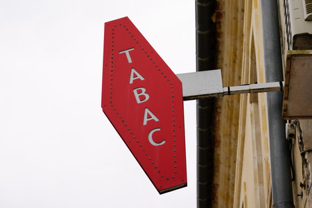 Toulouse, Occitanie France - 06 06 2021: tobacco text label red logo shop tobacco logo sign in france front of retail storeのeditorial素材