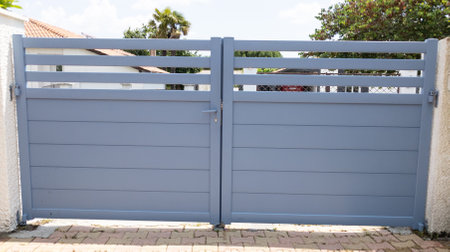 Aluminum gray steel gray metal gate of modern suburb house entranceの写真素材