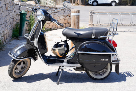 SÃ¨te, ocitanie France - 06 30 2021: vespa px 125 scooter with vintage look in city street parked with elmetのeditorial素材