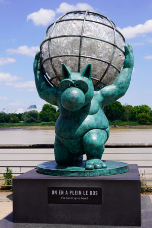 Bordeaux, Aquitaine France - 07 04 2021: Exhibition Le chat deambule The cat walks with earth in back had it up in Bordeaux by Philippe Geluck statues cartoonistのeditorial素材