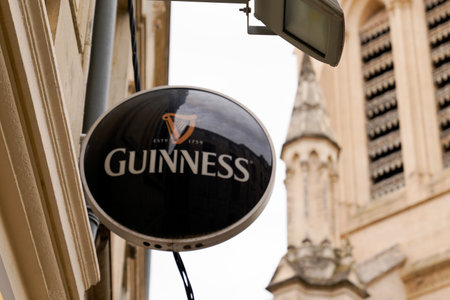 Bordeaux, Aquitaine France - 07 04 2021: guinness sign text and logo brand of irish beer on restaurant pub bar wall facadeのeditorial素材