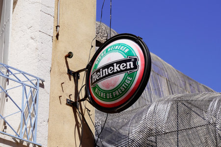 Bordeaux, Aquitaine France - 07 04 2021: Heineken logo brand and text round sign of pale lager beer on bar restaurant wall pubのeditorial素材