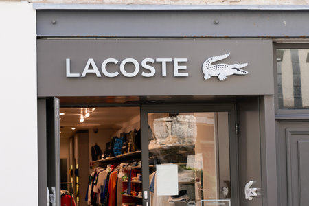 toulouse, occitanie France - 06 25 2021: Lacoste crocodile sign text store and logo brand shop on facade boutiqueのeditorial素材