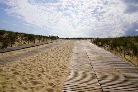 Wooden sand pathway access to Cap Ferret sea atlantic beach coast in gironde franceの写真素材