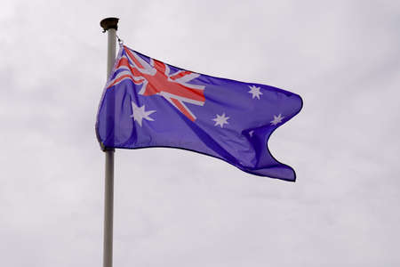 australian flag in cloud sky in Australiaの写真素材