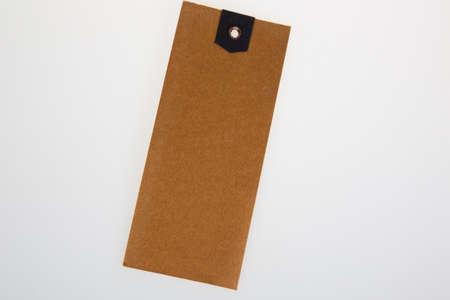 Blank kraft paper badge label brown carton of clothing isolated on white empty background