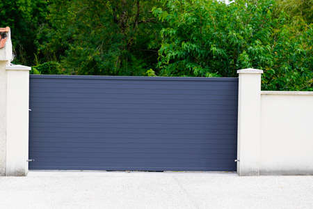 Aluminum gray steel sliding gray metal slide gate of modern suburb house entrance