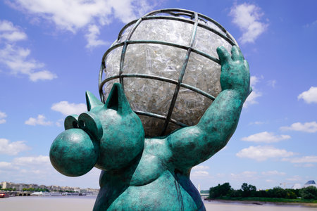 Bordeaux, Aquitaine France - 07 04 2021: Exhibition Le chat deambule The cat walks with round big earth in back had it up in Bordeaux by Philippe Geluck statues cartoonistのeditorial素材