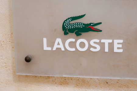 Bordeaux, Aquitaine France - 08 15 2021: Lacoste crocodile logo brand and text sign of shop fashion clothing luxury store frontのeditorial素材