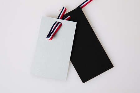 two gray and black tag label with tricolor ribbon french color blue white red isolated in gray...