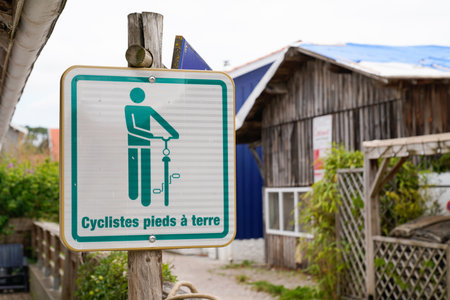 cyclistes pied a terre french text road panel means foot-on-the-ground for cyclists information signage in village franceのeditorial素材