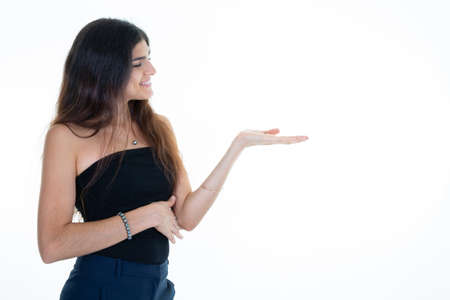 profile woman presenting palm hand pointing finger over white background copy spaceの写真素材