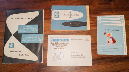 Bordeaux , Aquitaine  France - 09 20 2021 : Volkswagen vw logo brand and text sign 1950s vintage car service manual books flyer and leaflet on retro old car beetleのeditorial素材