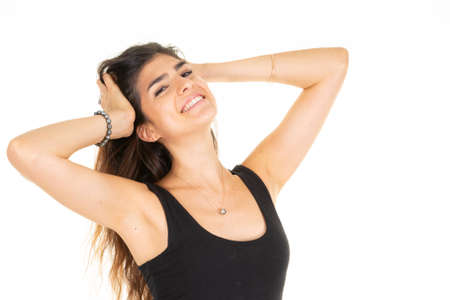 young woman posing hands on head on isolated background whiteの写真素材