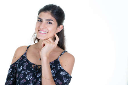 pretty woman portrait brunette girl over isolated white background smiling hand on chin face