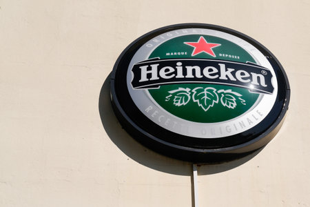 Bordeaux, Aquitaine France - 11 05 2021: Heineken logo brand and text round sign of pale lager beer on facade bar restaurant wall pubのeditorial素材