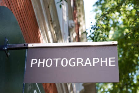 photographer text sign french means photographer front of store camera france photo digital photography shopの写真素材