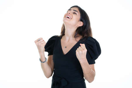 woman hands clenched fist happy with joy with raised hands and clenching fists