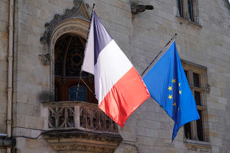 French and european eu flag waving in mat front of city hall in town of franceの写真素材