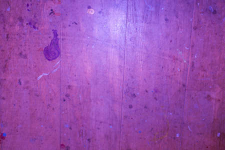 Wooden pink background with purple paintingの写真素材