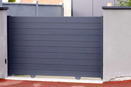 Aluminum steel gray high metal gate gray of suburb houseの写真素材