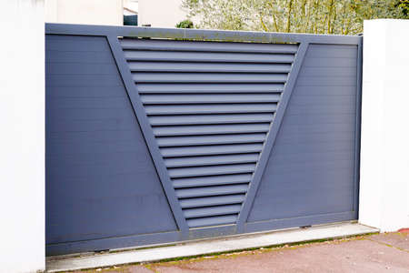 sliding modern high gate metal gray home fence on suburb house