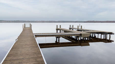 wooden pontoon coast beach beside Leon lake water in southwest franceの写真素材