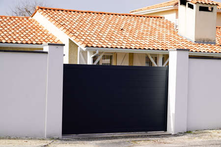 Aluminum black door steel dark gray metal gate of house street portal of suburb home