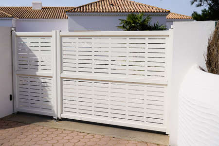 steel modern high white gate aluminum portal with blades design of suburban house
