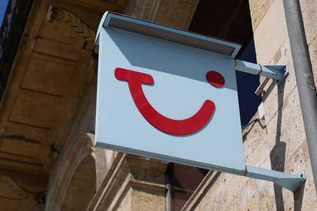 Bordeaux , Aquitaine France - 04 04 2022 : TUI logo brand red and blue smiling sign of office travel agents store agency wall facadeのeditorial素材