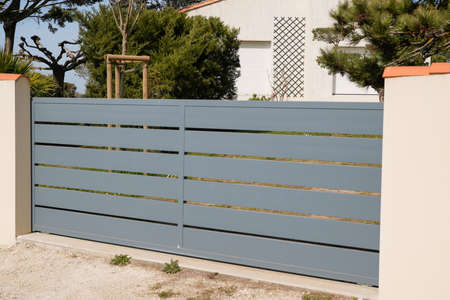 slide gray house steel sliding door aluminum gate at modern home entranceの写真素材