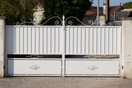 white classical metal home gate at entrance of house portal garden