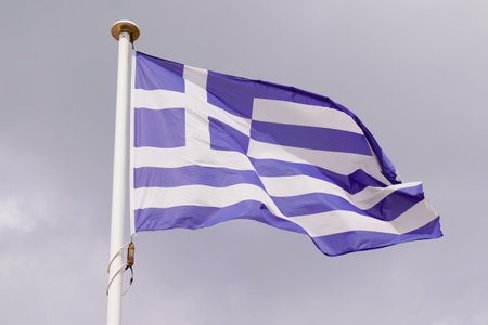 flag greek greece National state flag on wind mat with blue cloud skyの写真素材