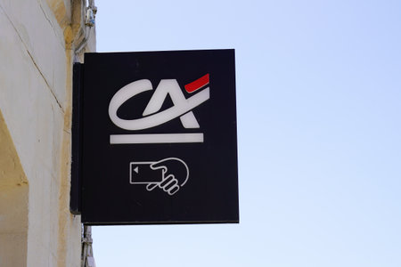 Bordeaux , Aquitaine France - 06 15 2022 : ca sign letters text and brand logo of Credit Agricole french bank and atm on black facade agency officeのeditorial素材