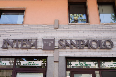 Milan, italy - 06 15 2022: Intesa Sanpaolo text sign and logo brand Bank branch one of biggest banks in Europeのeditorial素材