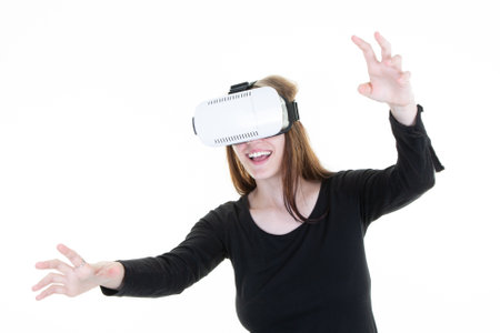 Young blond woman with glasses of virtual reality gesticulate on White background