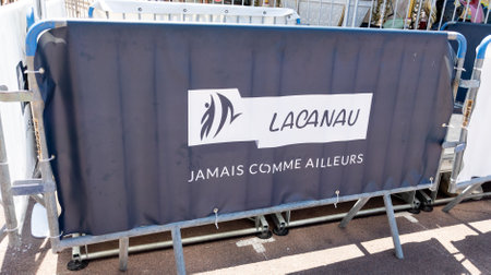 lacanau , Aquitaine France - 07 23 2022 : lacanau ocean town sign text on a barrier flag of the city of surfing in franceのeditorial素材