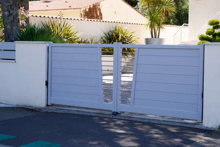 high gray modern home gate aluminum portal of suburbs house street city