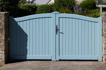 wooden door high blue clear gray gate of house wood portal gray of suburb access home