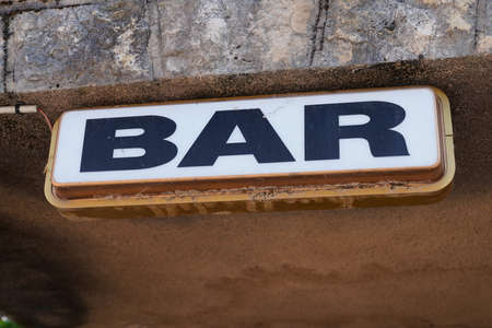 text bar on facade wall front building entrance cafe pub in streetの写真素材